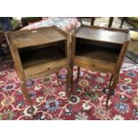 Pair of French satin walnut bedside tables with a lower drawer on slender cabriole legs