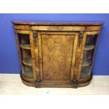 Good Victorian inlaid burr walnut credenza with ormolu decoration and glazed curving end cabinets