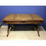 Leather topped writing table with 2 drawers & opposing dummy drawers 138 cm