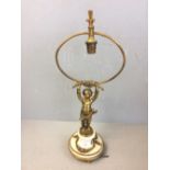 Brass cherub on a marble base supporting a table lamp fitting 48 cm