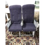 Pair of retro style old airline passenger seats