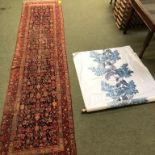 Persian runner with rust ground & a roll of Chintz material