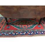 Small rug with blue, red & green border & blue central medallion 125 X 196 cm & Small red rug with