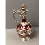 Ruby glass claret jug decorated with white metal possibly Bavarian