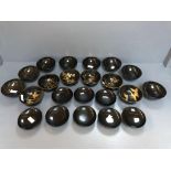 2 Sets of black lacquered Japanese bowls: 6 open bowls & 8 with lids decorated with gilt floral