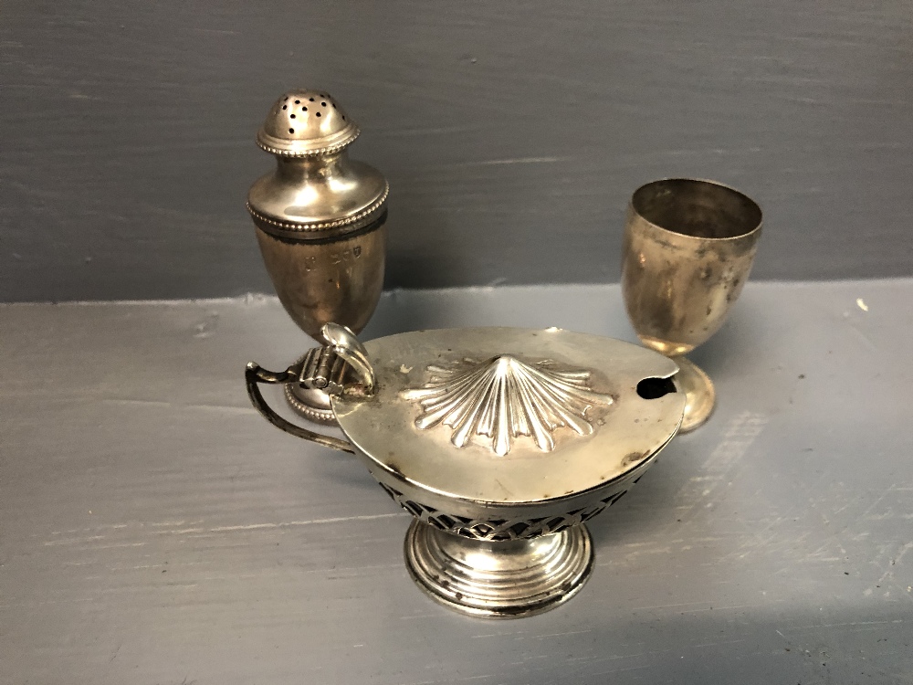 Pair of sterling silver pepperettes in the Adams style together with a sterling mustard pot with