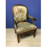 Victorian show framed open armchair, upholstered in a floral fabric