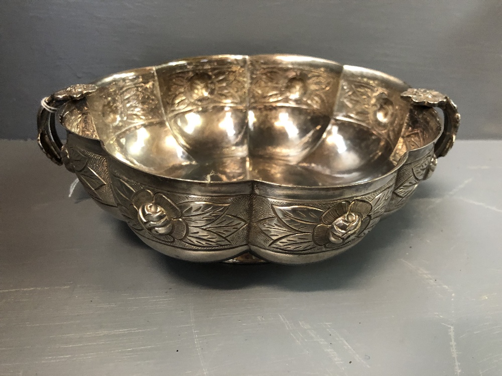 Mexican silver rose bowl with repousse decoration, loop handles with flower trellis, raised on a