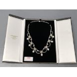 18ct White gold pearl & diamond necklace consisting of 7 oval shaped cultured pearls, suspended from