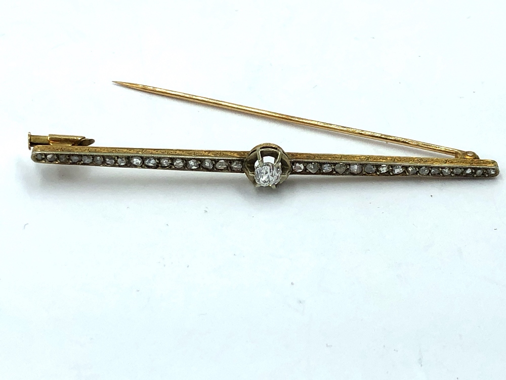 Diamond bar brooch