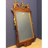 George III cushion framed wall mirror with shaped ears below a gilded broken pediment & bird