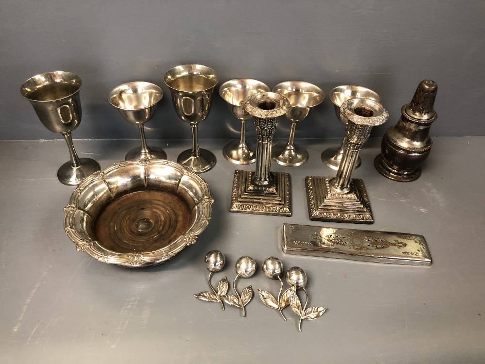 Collection of electroplated wares to include a pair of collumn candlesticks, wine coaster & other