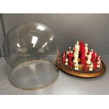 C19th Chinese carved ivory chess set in a glass domed display case