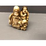 Carved Chinese ivory Netsuke depicting a family signed on base 4.5 cm