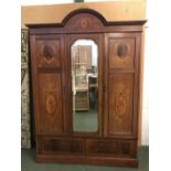 Edwardian inlaid mahogany wardrobe with hanging rail over 2 drawers. The front with mirrored central