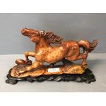 Soapstone pawing horse 25 x 17 cm on hardwood stand