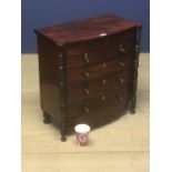 A fine quality small apprentice bow fronted mahogany chest of 2 small drawers over 3 long drawers