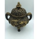 C19th gilded & black iron circular censer decorated all over with dragons & foliage, pierced lid
