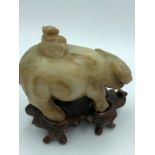 C18th/19th jade carving of a boy on buffalo, wood stand 11 cm H