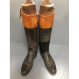 Pair of gentlemans black hunting boots with champagne tops by Maxwells Dover Street & fitted trees