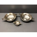 Pair of sterling silver Quaich style bowls by Goldsmiths & Silversmiths Company, together with one