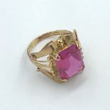 Synthetic ruby ring to a yellow metal mount 5.2g
