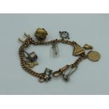 NO ONLINE BIDDING LOTS 1-30. 9ct gold churb link charm bracelet with 12 charms (some 9ct gold)