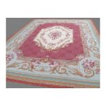 Finely hand woven needlepoint carpet of Aubusson style, with central cream floral medallion,