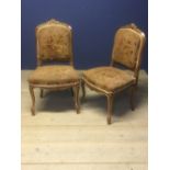 Pair of French chestnut side chairs with upholstered seats & backs on cabriole legs