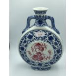 Chinese blue & white moon flask, with pink central pattern of bats & foliage 25h cm