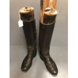 Pair of ladys black hunting boots with trees by Maxwells Dover Street
