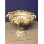 Large alabaster bird bath or vase extensively decorated with vine & grapes standing on a single