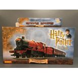 Hornby Hogwarts Express electric train set together with a Hogwarts Express coach both boxed