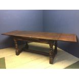 Good narrow draw leaf extending oak refectory dining table on turned legs united by central
