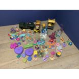 Large selection of Polly Pocket toys including the enchanted castles X 3, the charm bracelet & a