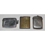 Cricket vesta. Brass metal vesta case with engraved image of a cricketer in cap stood in front of