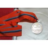 Bernard Thomas. England physio. Silver metal medal with orange and blue ribbon in presentation case,