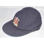 Nottinghamshire navy blue cloth 1st XI cap with embroidered Nottinghamshire emblem to front. Name