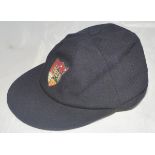 Gloucestershire navy blue county 1st XI cricket cap with county emblem embroidered/wired to front.