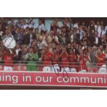 Manchester United. Colour photograph of the Manchester United team celebrating winning the Charity