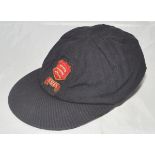 Essex 1st XI navy blue cloth cricket cap. The cap with attached wired Essex emblem of the three