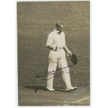 Don Bradman. Original mono press photograph of Bradman celebrating completing a century at The Oval.