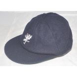 Somerset navy blue county 1st XI cricket cap with county emblem to front. Cap by Dege of Savile Row.