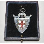 'S.E.L.A. Cricket League 1902'. Attractive shield shaped silver and red and white enamel medal by