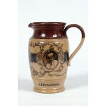 W.G. Grace. Doulton Lambeth stoneware jug with pale body and dark brown rim, decorated with three