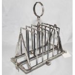 Cricketing toast rack. Silver metal (plated?) toast rack with six divisions with balled and