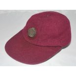 Northamptonshire C.C.C. maroon cloth 1st XI cricket cap. Earlier cap with attached wired