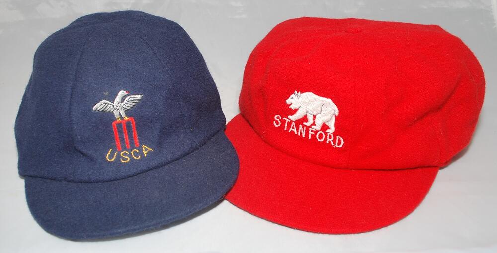 Cricket caps. Three caps, one, a red wool cap with emblem of a bear and 'Stanford' in white thread