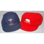 Cricket caps. Three caps, one, a red wool cap with emblem of a bear and 'Stanford' in white thread