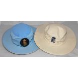 England. Two England broad brimmed sunhats, a light blue one with circular three lions emblem
